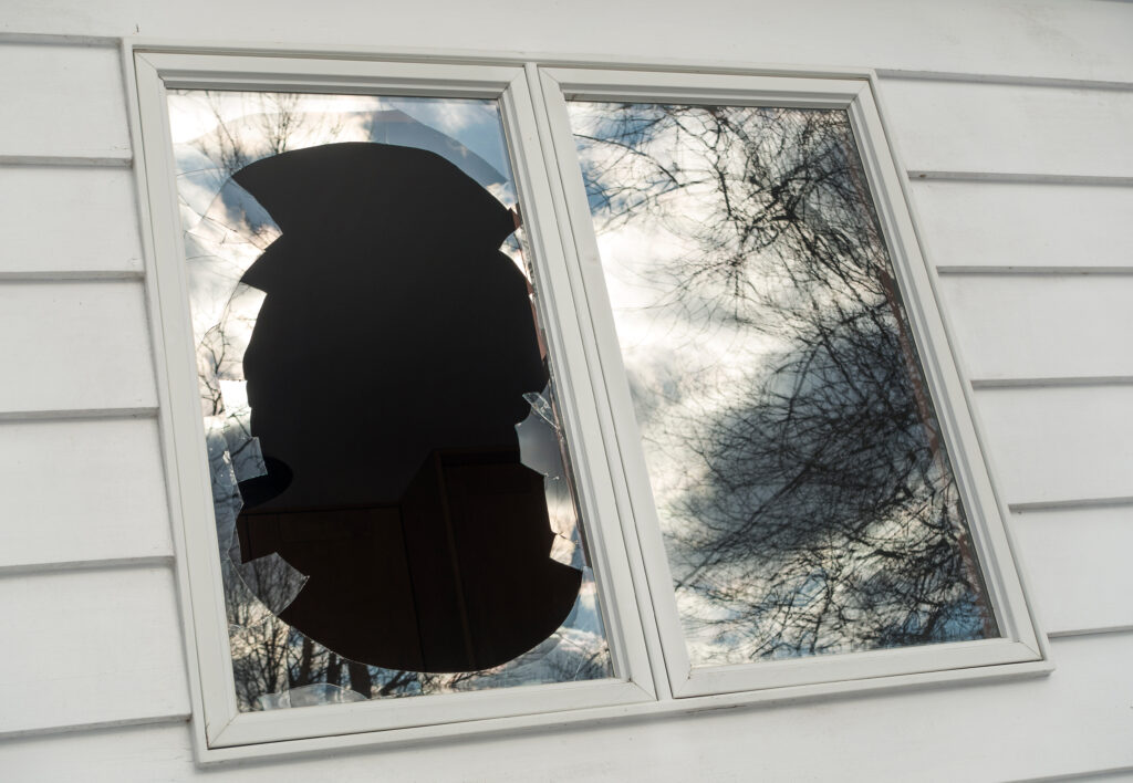 A broken residential window ready for glass replacement