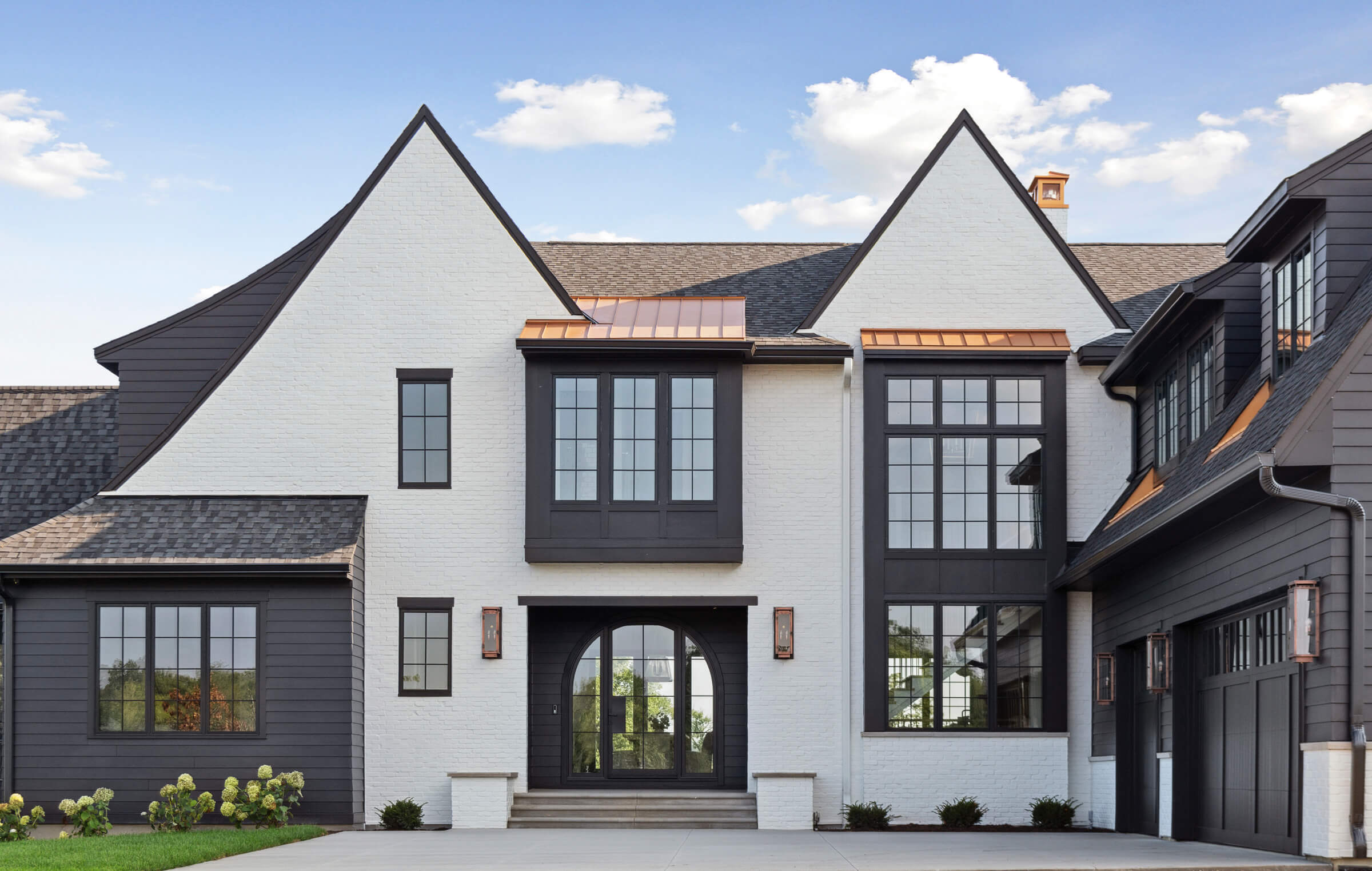 Large residence with black framed windows and doors